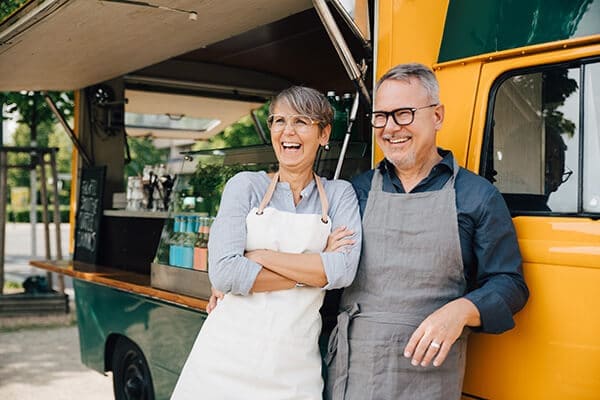 Older couple opening a food truck