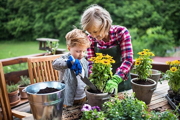 grandmother and granddaughter gardening together